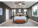 This bedroom features a four-poster bed, soft carpet, and a ceiling fan with a light at 5121 Hillside Haven Drive, Powder Springs, GA 30127