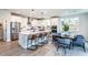Bright, modern kitchen with stainless steel appliances, white cabinets, quartz countertops, and an island with seating at 5121 Hillside Haven Drive, Powder Springs, GA 30127