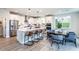 Bright and airy kitchen with white cabinets, stainless steel appliances, and an island with bar seating at 5121 Hillside Haven Drive, Powder Springs, GA 30127
