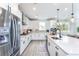Well-equipped kitchen with stainless steel appliances, a large island, and modern finishes at 5121 Hillside Haven Drive, Powder Springs, GA 30127