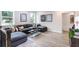 Comfortable living room with a sectional sofa, stylish decor, and ample natural light at 5121 Hillside Haven Drive, Powder Springs, GA 30127