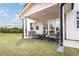Covered patio featuring seating area and view of the backyard at 5121 Hillside Haven Drive, Powder Springs, GA 30127