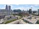 This aerial view showcases Atlanta's skyline with a mix of modern buildings and urban living at 860 Peachtree Ne St # 1712, Atlanta, GA 30308