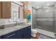 Sleek bathroom featuring a glass-enclosed shower, modern vanity, and stylish fixtures for a spa-like experience at 860 Peachtree Ne St # 1712, Atlanta, GA 30308