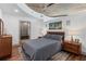 Cozy bedroom with a wooden bed frame, a neutral color palette, and an organized walk-in closet at 860 Peachtree Ne St # 1712, Atlanta, GA 30308