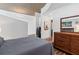 Bedroom view featuring wood floors, contemporary decor, and an attached office space, blending style and function at 860 Peachtree Ne St # 1712, Atlanta, GA 30308