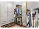 Well-organized walk-in closet with ample storage, custom shelving, and a minimalist design, maximizing space at 860 Peachtree Ne St # 1712, Atlanta, GA 30308