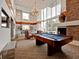 Well appointed game room with billiards table and fireplace at 860 Peachtree Ne St # 1712, Atlanta, GA 30308