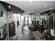 A well-equipped gym features various exercise machines, free weights, and mirrors for a full body workout at 860 Peachtree Ne St # 1712, Atlanta, GA 30308
