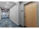Hallway with patterned carpet and modern lighting leading to unit 1712 at 860 Peachtree Ne St # 1712, Atlanta, GA 30308