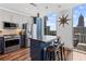 Modern kitchen with stainless steel appliances, island, and floor-to-ceiling windows offering city views at 860 Peachtree Ne St # 1712, Atlanta, GA 30308