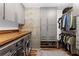 Functional laundry room with modern washer/dryer, custom cabinets, and ample storage space for household needs at 860 Peachtree Ne St # 1712, Atlanta, GA 30308