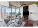 Living room with floor-to-ceiling windows, leather sofa, and city views at 860 Peachtree Ne St # 1712, Atlanta, GA 30308