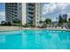 Large outdoor community pool surrounded by lounge chairs at 860 Peachtree Ne St # 1712, Atlanta, GA 30308