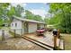 Stained wooden deck and patio, with outdoor seating and a gas grill at 1118 Creekdale Dr, Clarkston, GA 30021
