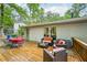 Backyard deck with dining and seating areas, offering a relaxing outdoor space at 1118 Creekdale Dr, Clarkston, GA 30021