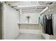 Basement closet showcasing clothing rack, shelving, and decor at 1118 Creekdale Dr, Clarkston, GA 30021