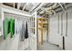 Basement closet showcasing clothing rack and shelving unit at 1118 Creekdale Dr, Clarkston, GA 30021