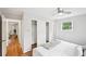 Bright bedroom showcasing a ceiling fan, large closet, and an entrance into another room at 1118 Creekdale Dr, Clarkston, GA 30021