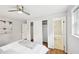 Bright bedroom with ceiling fan and closet, featuring an attached bathroom at 1118 Creekdale Dr, Clarkston, GA 30021
