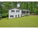 Charming, split-level home boasting a well-manicured lawn and inviting front porch at 1118 Creekdale Dr, Clarkston, GA 30021