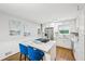 Bright kitchen with white cabinets, stainless steel appliances, and a marble-topped island with seating at 1118 Creekdale Dr, Clarkston, GA 30021