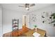 Cozy home office space with hardwood floors, ceiling fan, and an open desk area at 1118 Creekdale Dr, Clarkston, GA 30021