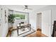 Bright home office with hardwood floors, natural light, and a built-in closet for storage at 1118 Creekdale Dr, Clarkston, GA 30021