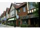 Charming Tudor-style commercial building featuring brick facade, large windows, and gable roof details at 1118 Creekdale Dr, Clarkston, GA 30021
