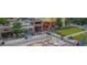 Aerial view of town square with pedestrian walkways, quaint shops, and well-maintained green spaces at 1118 Creekdale Dr, Clarkston, GA 30021