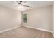 This is a standard bedroom boasting a ceiling fan and a sunlit window, offering comfort and style at 4910 Bucknell Trce, Cumming, GA 30028