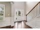 Bright foyer with hardwood floors, staircase, and a front door with sidelights at 4910 Bucknell Trce, Cumming, GA 30028