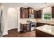 Gourmet kitchen with granite countertops, stainless steel appliances, and ample cabinet space at 4910 Bucknell Trce, Cumming, GA 30028