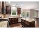 Well-equipped kitchen with granite counters, stainless appliances, and center island at 4910 Bucknell Trce, Cumming, GA 30028