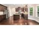 Modern kitchen features stainless steel appliances, granite countertops, and a center island at 4910 Bucknell Trce, Cumming, GA 30028