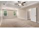 Spacious main bedroom with tray ceiling, neutral carpet, and abundant natural light at 4910 Bucknell Trce, Cumming, GA 30028