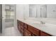 Bathroom vanity with double sinks and dark wood cabinets at 7280 Wright Dr, Atlanta, GA 30349