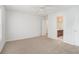 Neutral bedroom with attached bathroom and neutral carpet at 7280 Wright Dr, Atlanta, GA 30349