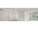 A spacious bedroom has carpet, a tray ceiling with fan, and two doorways to other rooms at 7280 Wright Dr, Atlanta, GA 30349