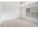Empty bedroom with neutral carpet, ceiling fan, and natural light at 7280 Wright Dr, Atlanta, GA 30349