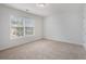 Empty bedroom with neutral colored carpet, natural light and a blank canvas at 7280 Wright Dr, Atlanta, GA 30349