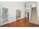 Elegant foyer with hardwood floors, staircase, and high ceilings creates a grand entrance at 7280 Wright Dr, Atlanta, GA 30349