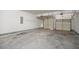 A spacious, two-car garage with two doors and an unfinished concrete floor at 7280 Wright Dr, Atlanta, GA 30349