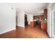 Bright kitchen with hardwood floors, wooden cabinets, black appliances, and an open layout, perfect for cooking at 7280 Wright Dr, Atlanta, GA 30349