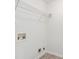 A laundry room featuring connections for a washer and dryer, as well as a wire shelf for storage at 7280 Wright Dr, Atlanta, GA 30349
