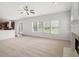 Open living room with fireplace and access to kitchen and backyard, great for entertaining at 7280 Wright Dr, Atlanta, GA 30349