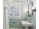 Bathroom with a pedestal sink, updated fixtures, and natural light at 96 Dartmouth Ave, Avondale Estates, GA 30002