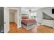 Spacious bedroom features hardwood floors, ceiling fan, and natural light from the large window at 96 Dartmouth Ave, Avondale Estates, GA 30002