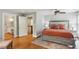 Bright bedroom showcases hardwood floors, ceiling fan, and access to an ensuite bathroom at 96 Dartmouth Ave, Avondale Estates, GA 30002