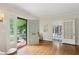 Welcoming entrance hall with hardwood floors and ample natural light, showing view to office at 96 Dartmouth Ave, Avondale Estates, GA 30002